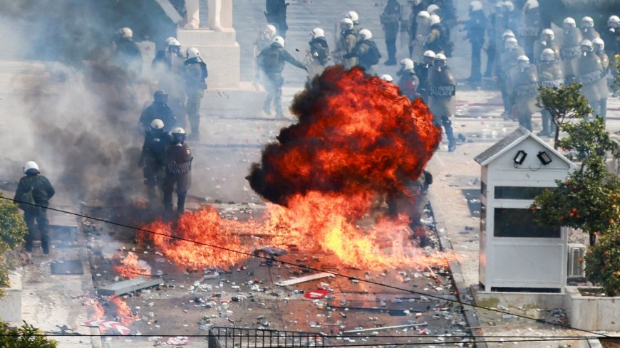 Protesters hurl petrol bombs and police fire tear gas as demonstration in Greece turns violent