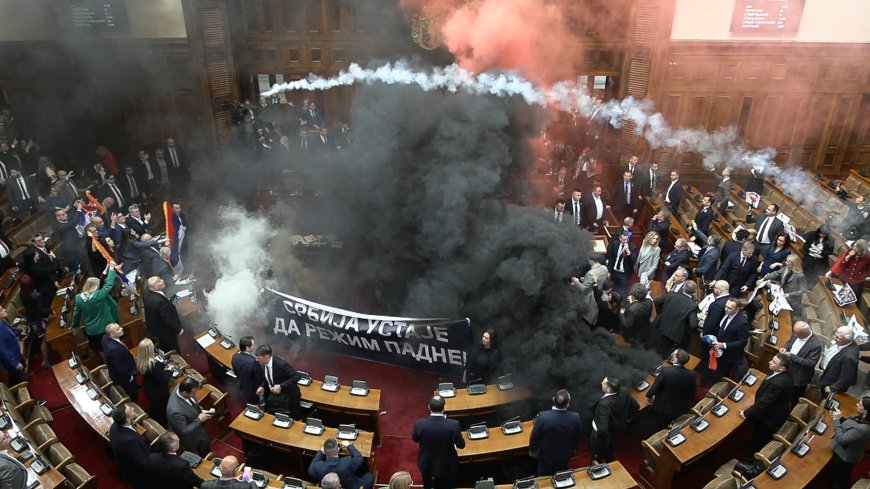 Smoke bombs thrown in Serbia parliament as three MPs injured