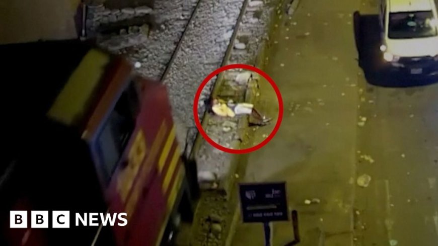 Watch: Man survives being run over by train